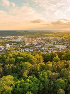 View over the city with skyscrapers and surrounding forests at sunset, Engelberg Tower, Leonberg,