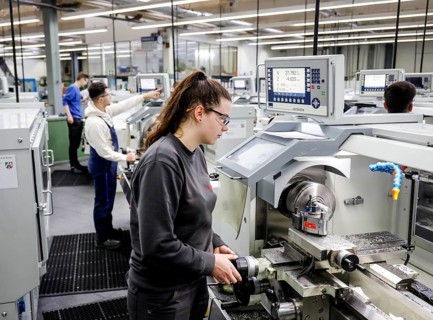Remscheid, North Rhine-Westphalia, Germany - Trainee woman in metalworking professions working on