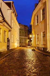 Tallinn Old Town street with cobblestones in night, Estonia