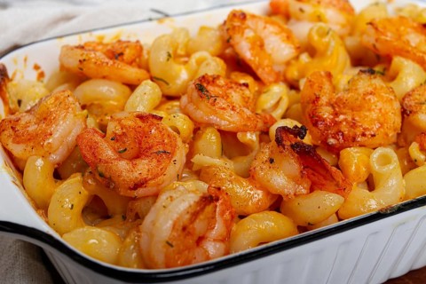 Pasta with shrimp and cheese, with a golden crust, cooked in a baking dish, homemade, no people