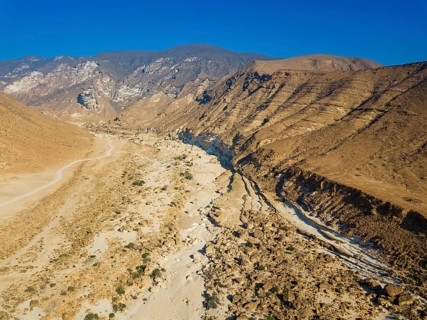 Landscape in Oman, mountains, Wadi Ashawq, road, dry riverbed Salalah, Al Mughsyal / Wadi Ashawq,