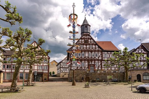 Maypole and town hall of the town of Sontra, Hesse, Germany