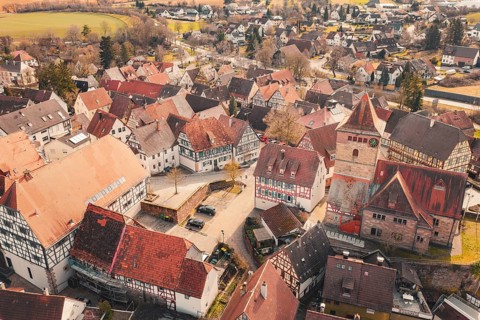 Historic old town with a central church and many traditional half-timbered houses, Ötisheim,