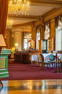 Opulent lounge with bar, decorated with chandeliers and classic interior, Grandhotel Giessbach,