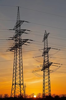 Sunset behind high-voltage pylons, Häcklingen, Lüneburg, Lower Saxony, Germany