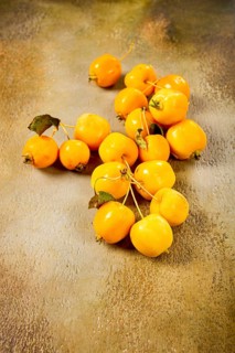 Yellow small apples, Chinese variety, scattered on the table, top view, no people