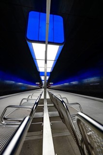 Futuristic underground station with blue lights and metal benches, Hafencity University, Hamburg,