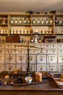 Old pharmacy, counter with scales, counter, herbs, medicines, pharmacist's cabinet with drawers,