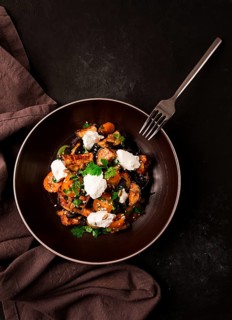 Warm Salad with crispy eggplant and tomatoes, cottage cheese, spices, herbs, sesame seeds,