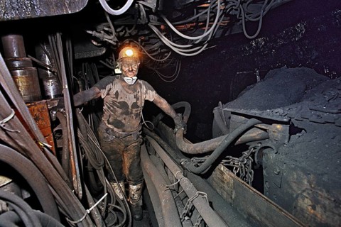 Herten, DEU, 31.03.1995 - Miner at Ruhrkohle Ewald works underground in coal seam. The mine was