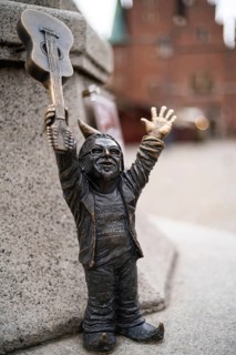 WROCLAW, POLAND - NOVEMBER 10, 2023: Statue of dwarves representing World Guinnes Record by playing