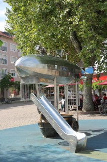 Children's playground with Zeppelin airship, children, play, children's slide, children's slide,
