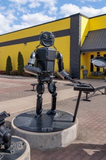 Cast iron robot sculptures at the entrance to the Lodge Museum of Cast Iron and factory store in