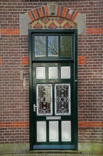 Black front door with window, brick house, Den Burg, Texel, North Holland, Holland, Netherlands