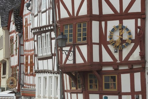 Half-timbered houses with clock and nose sign, front of houses, Bischofsplatz, Limburg, Hesse,