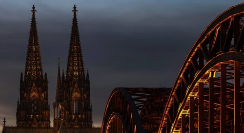 Evening atmosphere, Cologne Cathedral illuminated with LED lamps and the Hohenzollern Bridge,