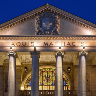 Portico with glass window, illuminated spa hotel and Casino in the evening, Wiesbaden, Hesse,