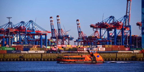 HADAG's harbour ferry MS Kehrwieder in front of the container gantry cranes at the Burchardkai