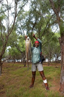 Mauritian woman, 35 years old, with an octopus, Rodrigues Island, Mauritius