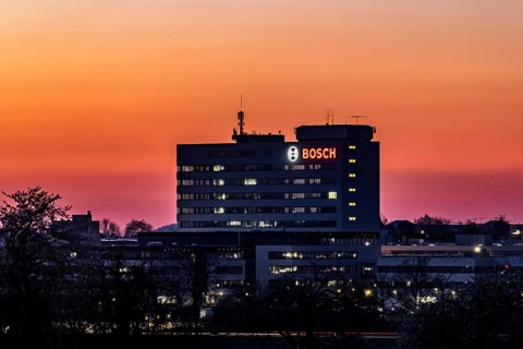Bosch factory at sunset. Illuminated logo of the company. Schwieberdingen, Baden-Württemberg,