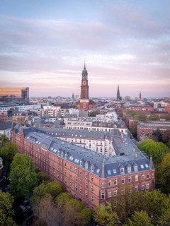 Aerial view over Hamburg at dusk with the main church St Michaelis (Michel), historic brick