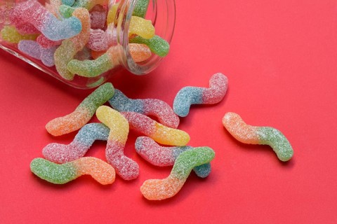 Lots of colorful jelly sweets with glass containers