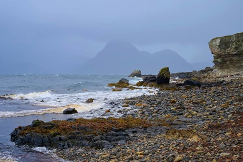 Rocky shoreline at sea under a cloudy sky with waves, Elgol Beach, Elgol, Isle of Skye, Scotland,