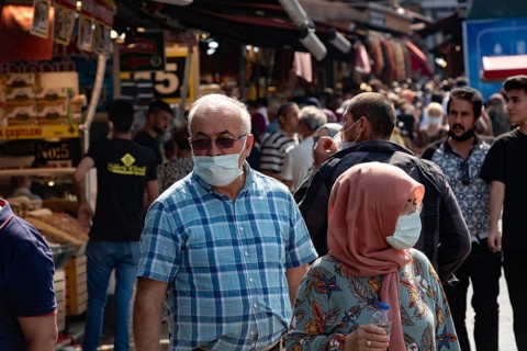 Istanbul, Turkey 25th August 2021 A Turkish couple wearing protective face masks in a busy market
