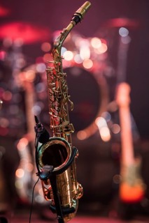 Saxophone on the stage in the background other instruments