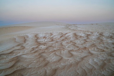 Sunset, white sand dunes in the Khaluf desert, Oman