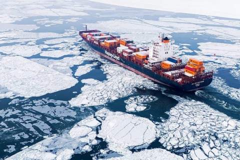 Container ship going up the frozen St. Lawrence River, Region of Center Quebec, Province of Quebec,