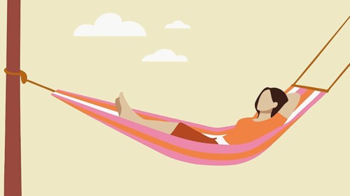 A woman with long hair lounges in a vibrant hammock, enjoying a peaceful afternoon. She appears