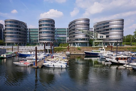 Five Boats office building by architect Sir Nicholas Grimshaw & Partners and the marina in the