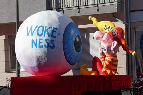 Wokeness eye looks at personified satire, figure is afraid of bans, themed float by Jacques Tilly,