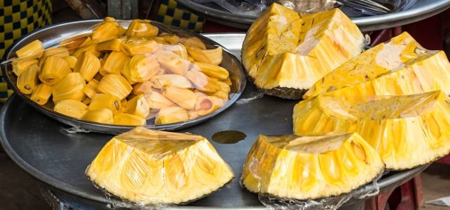 Jackfruit slices on a metal tray on the market, Vietnam