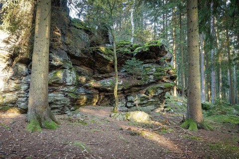 Schwarzer Stein rock formation with Versteinerter Mönch rock formation east of Grünbach in
