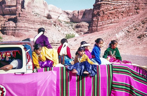 Diné Navajo children and families sitting on back of a truck, Navajo Nation Fair Parade, American
