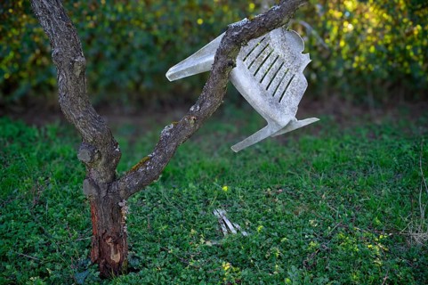 Monobloc seating furniture, chair, broken, defective, hanging in peach tree, Stuttgart,