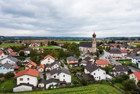 Drone shot, view of village with church, Burgkirchen, Innviertel, Upper Austria, Austria