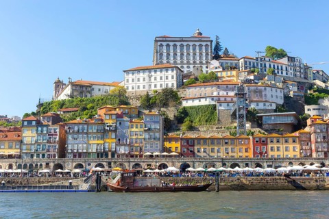 Historic riverside buildings on hillside of Ribeira next to River Douro, Porto, Portugal, Europe