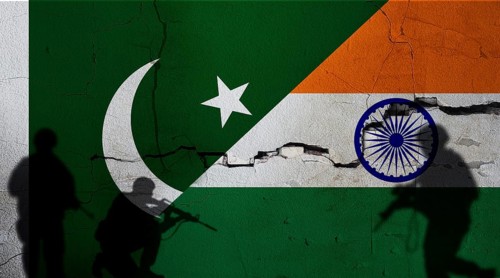 Pakistan vs India flag on cracked wall. Conflict between Pakistan and India concept. Political