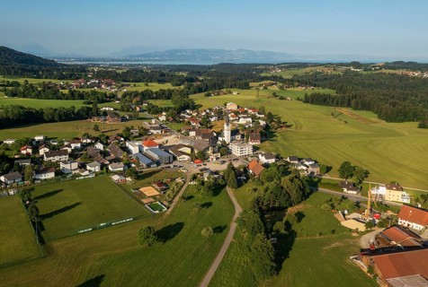 Drone image, view of village with parish church, Hohenweiler, Vorarlberg, Austria