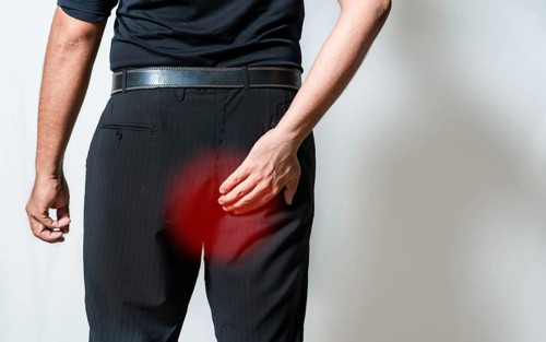 People with diarrhea problem touching buttock isolated. Person suffering with hemorrhoid problem