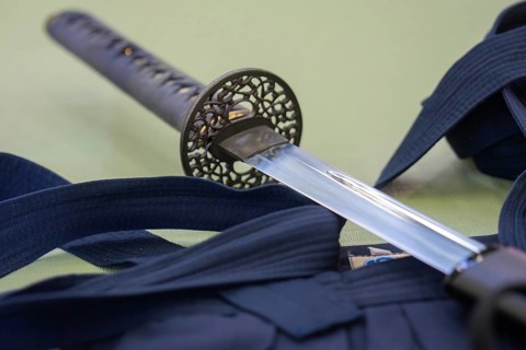 A katana lies on a kimono used for traditional Japanese martial arts, Aikaido, Calw, Germany