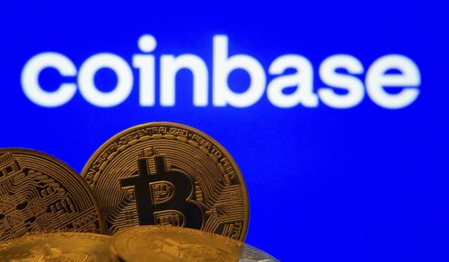 Dhaka, Bangladesh- 16 June 2025: Close-up of Bitcoin coins with the Coinbase logo visible on a