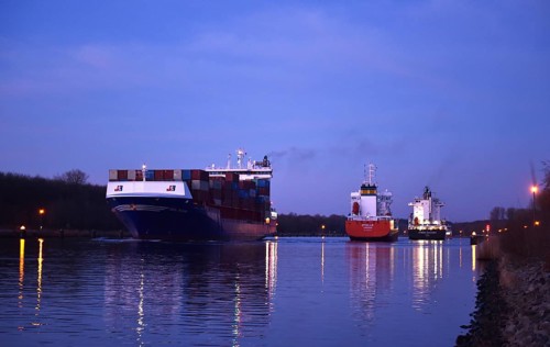 Container ship OOCL RAUMA at the blue hour, sunrise in the Kiel Canal, NOK, Kiel Canal,