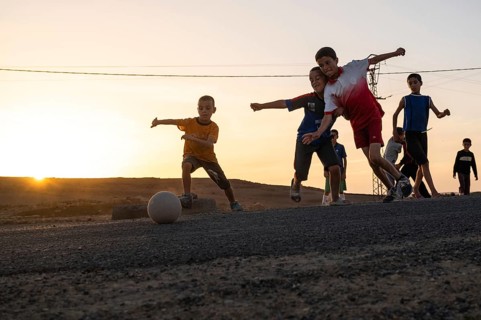 Taouloukoult, MOROCCO - OCTOBER 6, 2024: young boys spend the afternoon playing amateur football on
