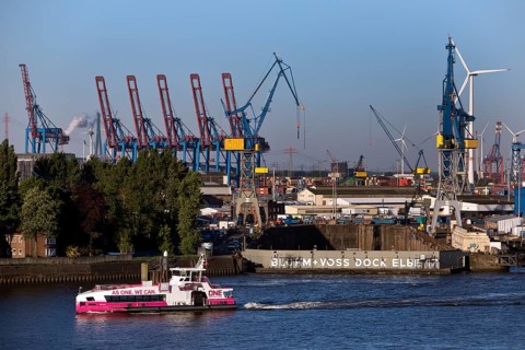 Hybrid harbour ferry Neuland of HADAG in front of the empty Blohm und Voss dry dock Elbe 17 in the