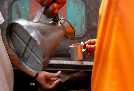 A fuel station attendant refuels a auto rickshaw at a petrol pump in Guwahati, India, on March 11,
