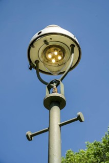 Old gas lantern also burns during the day, Berlin, Germany